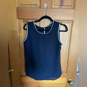 Size small light cut off blouse, brand DKN